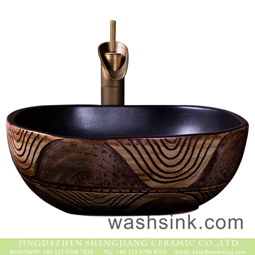 XXDD-23-4 Shengjiang factory outlet Chinese vintage style bowl shape bathroom table top sink with black wall and beautiful wood color surface featuring irregular carved lines XXDD-23-4 - shengjiang  ceramic  factory   porcelain art hand basin wash sink