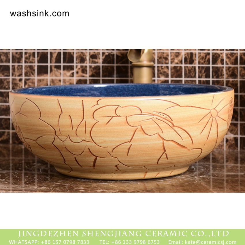 XHTC-X-1094-1 Shengjiang factory Chinese style original ceramic wash basin with deep blue wall and wood color surface featuring carved lotus pattern XHTC-X-1094-1 - shengjiang  ceramic  factory   porcelain art hand basin wash sink