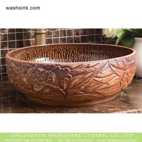Roman style round ceramic lavabo with variable glaze wall and elaborate pure hand carved floral and leaf pattern on wood grain glaze surface XHTC-X-1090-1