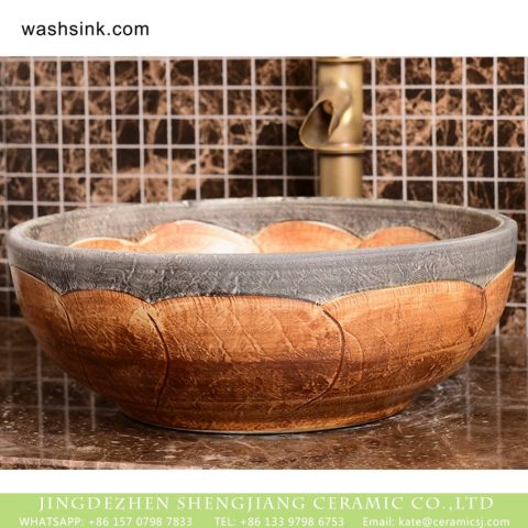 Hot sale  Shengjiang factory direct European retro style pure handmade porcelain bowl shape vanity basin wood color surface with carved wave pattern and stone color edge XHTC-X-2072-1