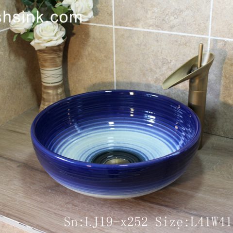 LJ19-x252     Arts and crafts ceramic with blue rim sanitary ware