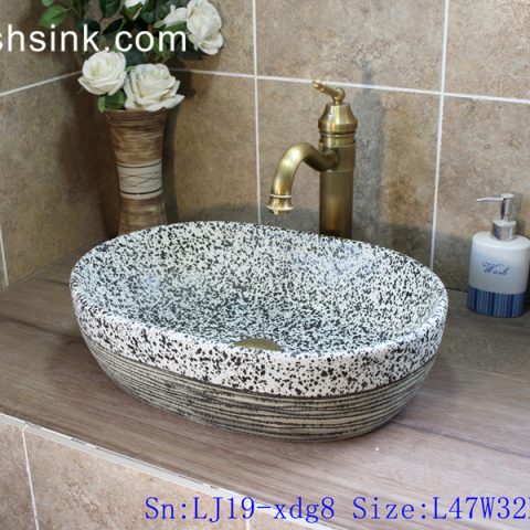 LJ19-xdg8     Marble color ceramic with hand carved stripe bottom lavabo